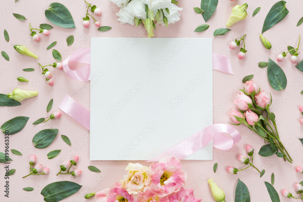Top view of round flower frame with leaves and copy space isolated on pink background, flat lay. Greeting card concept Top view of round flower frame with leaves and copy space isolated on pink background, flat lay. Greeting card concept