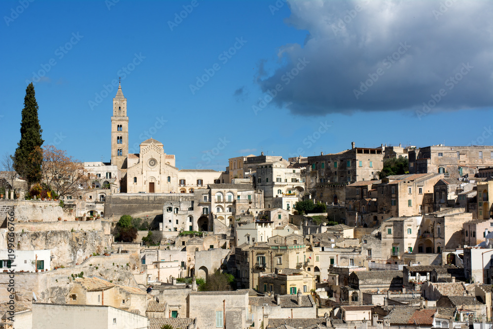 Horizontal View of the City of Matera on Blue Sky Background. Matera, South Of Italy Horizontal View of the City of Matera on Blue Sky Background. Matera, South Of Italy
