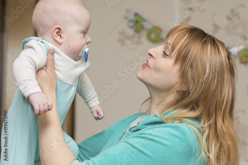 mom plays with baby