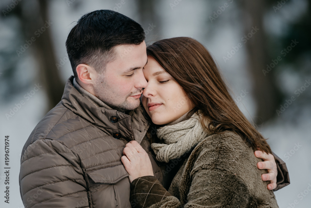 Young man with his gorgeous girlfriend. Close portrait of two lovers. Young man with his gorgeous girlfriend. Close portrait of two lovers.