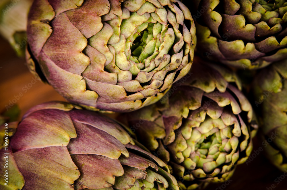 Fototapeta premium Italian artichokes on wooden plane