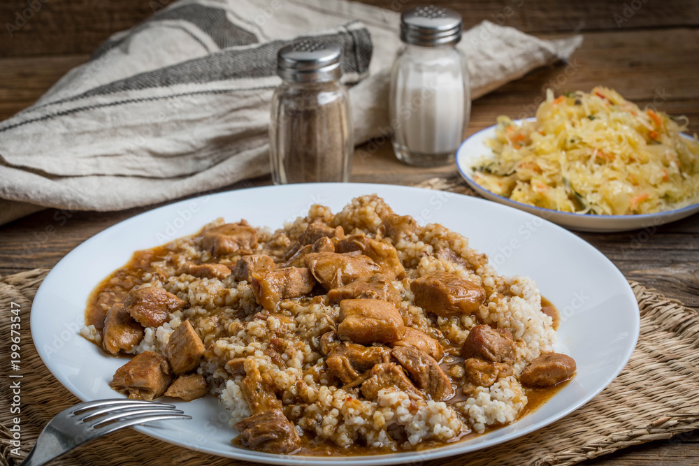 Barley groats with stewed meat.