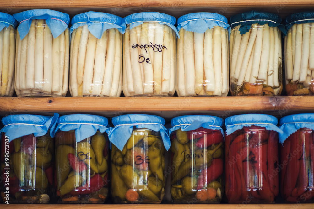 Greek homemade jam and canned food on the shelves of local shops