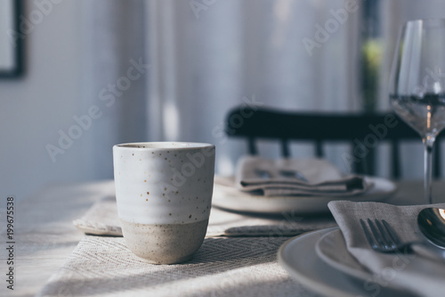 ceramic tea cup on dining table color tone concept