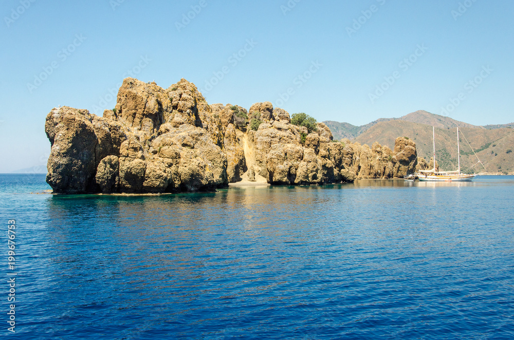 View island in Turkey Aegean Sea water Rocky coast deserted near Marmaris Ichmeler summer holiday trip panorama landscape
