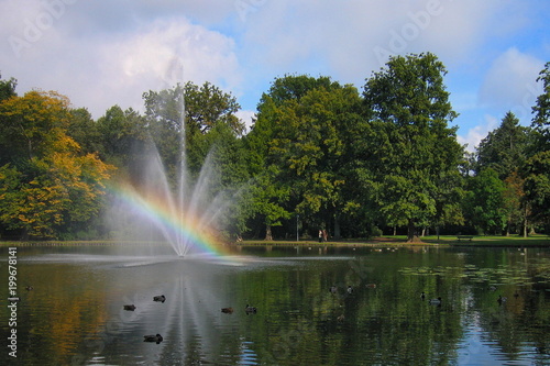 Landscape with a beautiful rainbow in the fountain.