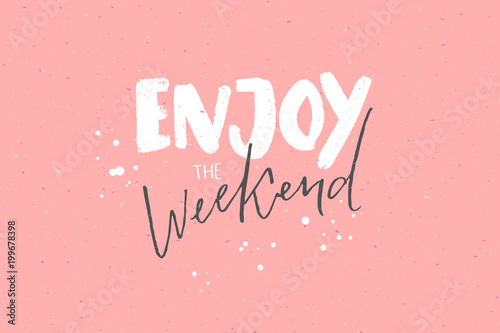 Enjoy the weekend. Inspirational caption, handwritten text on pastel pink background photo