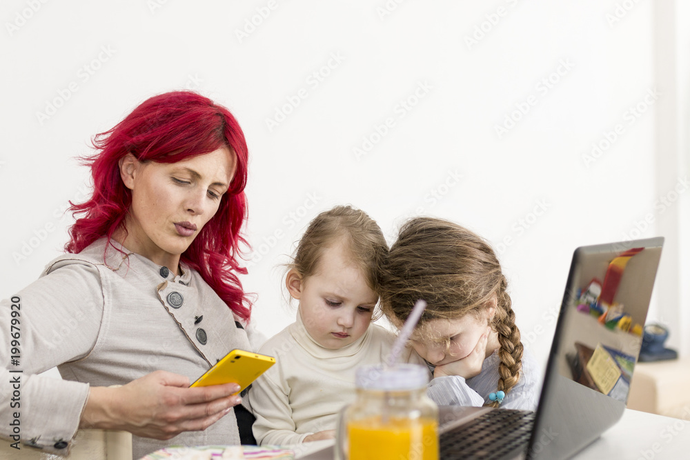 Work-From-Home Mom Texting with Kids on Her Lap Work-From-Home Mom Texting with Kids on Her Lap