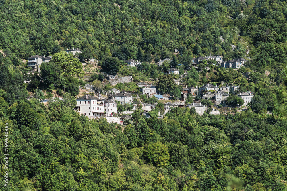 Traditional house and village in the mountain in Greece in the Zagoria region. National park of Pindus mountain Traditional house and village in the mountain in Greece in the Zagoria region. National park of Pindus mountain