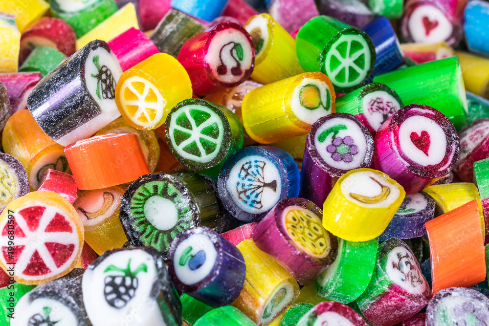 Colorful candy sweets close up. different tastes and drawings of fruits on candies, made in prague