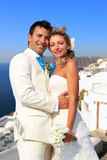 Couple bride and groom celebrate wedding on Santorini