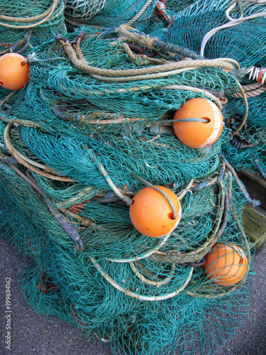 Laesoe / Denmark: A wooden pallet with fishing nets on the pier in Vesteroe Havn photo