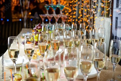 Line of glasses with champagne at the furshet