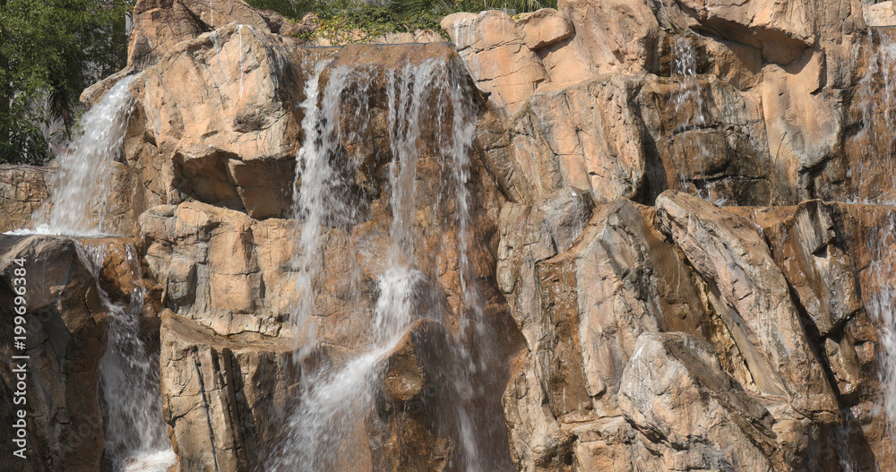 Waterfall over rock wall Waterfall over rock wall