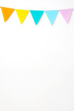 Colorful party flags hanging on white wall  background, birthday, anniversary, celebrate event, festival greeting card background