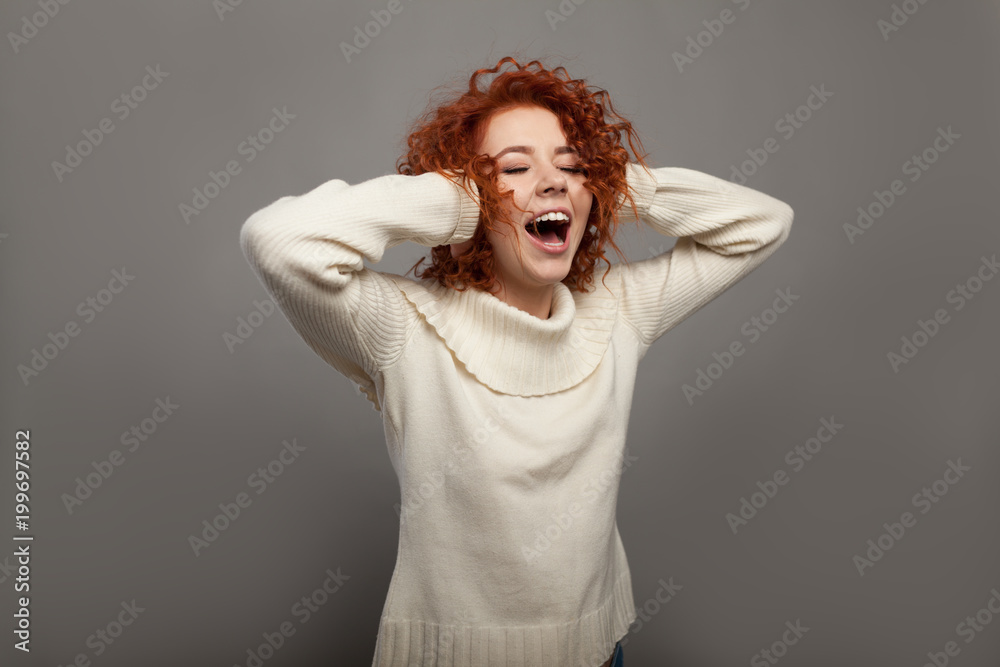 Beautiful redhead curly woman screams in shock Beautiful redhead curly woman screams in shock