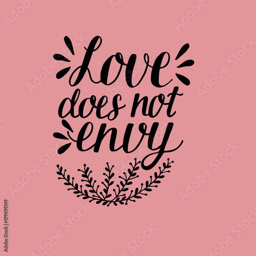 Hand lettering with bible verse Love does not envy made with flowers.