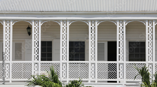 old white guest house decorative balcony, St. Kitts, Lesser Antillies, Caribbean photo