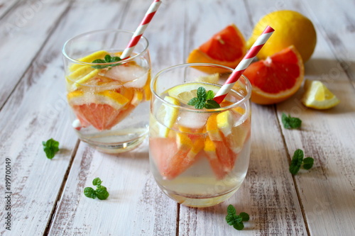 Summer drinks with grapefruit, lemon and ice. Top view. photo