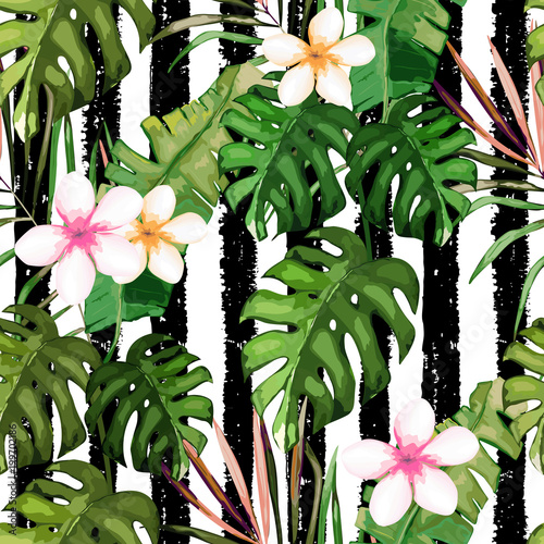 Tropical seamless pattern. Palm tree leaves and flower. Hand drawn vector ill...