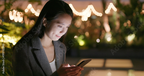 Photography Business sending sms on smart phone at night