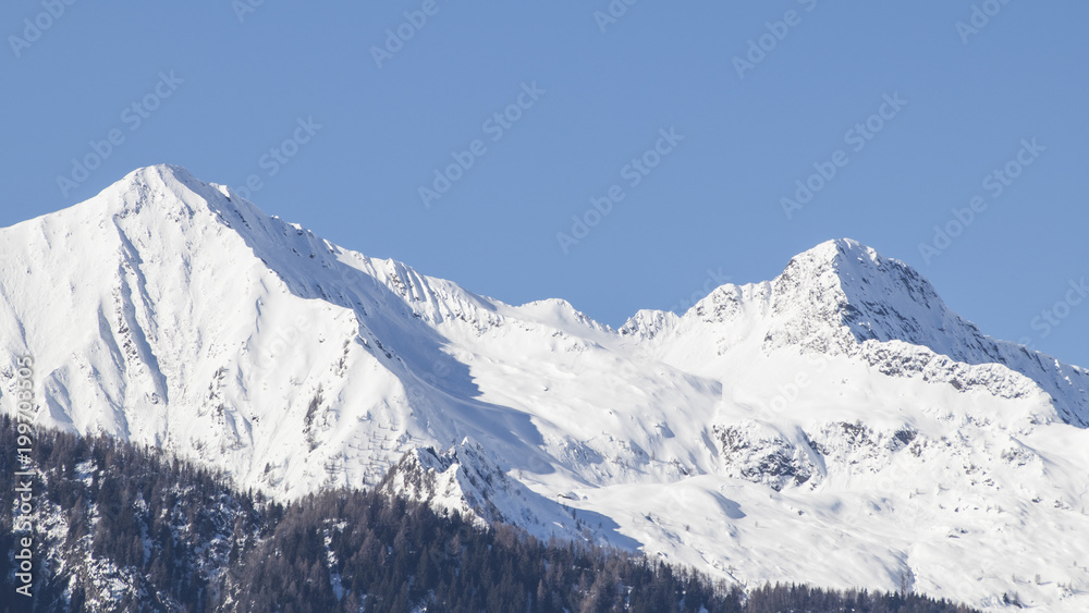 European alps full of snow in a blue sky European alps full of snow in a blue sky