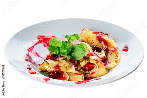 Sweet dessert. Delicious pancakes with curd served with cherry jam and mint, isolated on white background