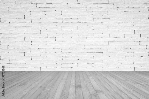 Grunge old aged brick wall painted in white color with wooden floor textured background in light grey with vignette