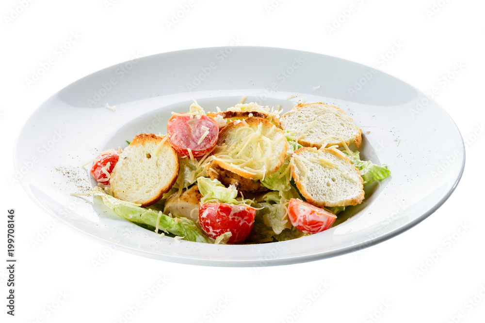 New menu in the restaurant. Appetizing salad with chicken, tomatoes and toastes isolated on white background