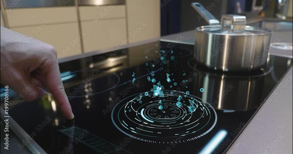 Close up of a man who cooks in his own home on a stove of the latest technology and regulates power and intensity thanks to holography. Concept of: future, technology, kitchen, augmented reality. Close up of a man who cooks in his own home on a stove of the latest technology and regulates power and intensity thanks to holography. Concept of: future, technology, kitchen, augmented reality.