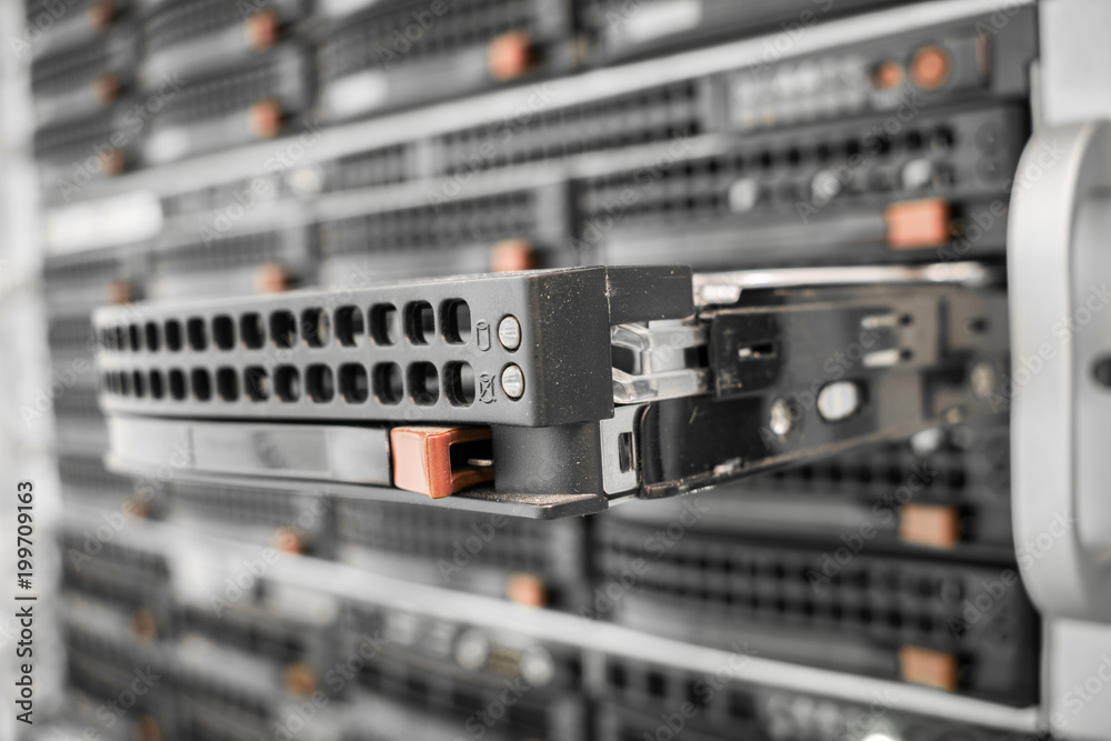 The hard drive in the computer server is close-up. Data storage is performed on media. Selective focus The hard drive in the computer server is close-up. Data storage is performed on media. Selective focus