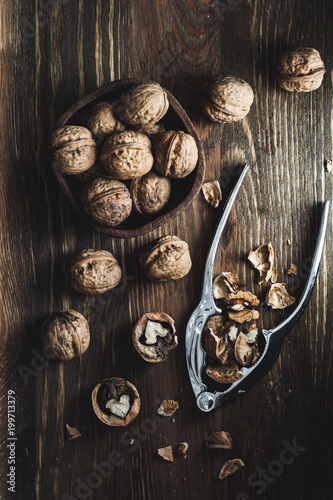 Walnuts on wooden table in overhead view