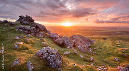 Fototapeta Naklejka Na Ścianę i Meble -  Vivid sunset fron Sourton tor Dartmoor national park Devon uk