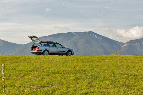 Fototapeta Naklejka Na Ścianę i Meble -  hatchback car on the top of the hill