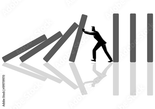 Businessman trying to stop domino effect
