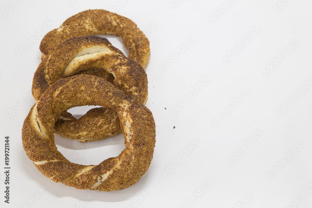 Simit (Turkish bagel) isolated on white background . Tea concept with bagel . Simit (Turkish bagel) isolated on white background . Tea concept with bagel .