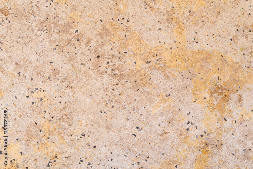 Full frame background texture of orange/peachy cement flooring or wall with small rocks. Full frame background texture of orange/peachy cement flooring or wall with small rocks.