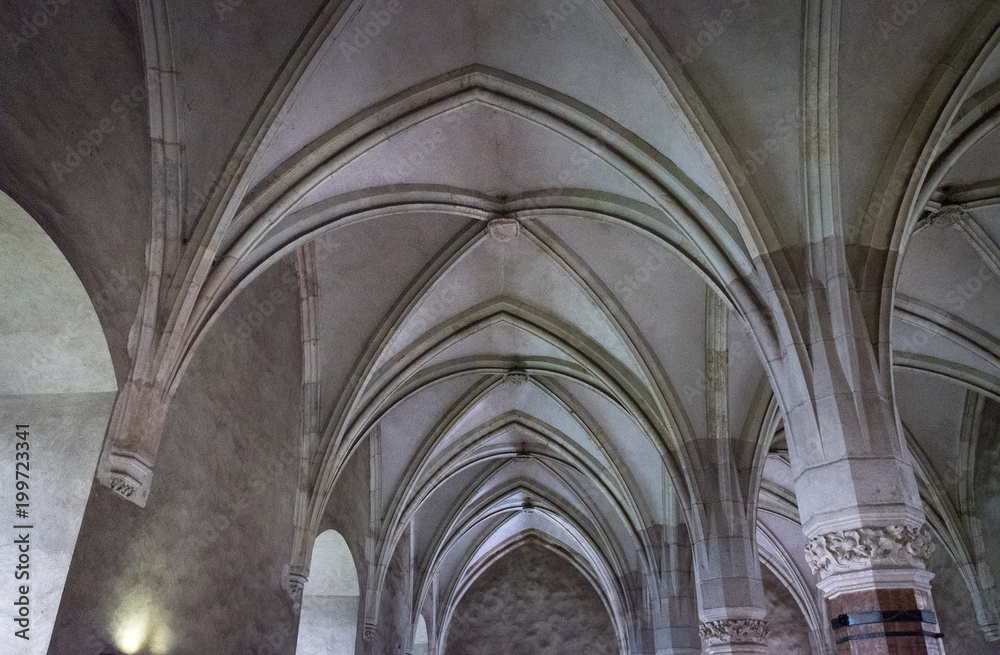 Knight's Hall and gothic arches of Corvin Castle in Hunedoara, Romania