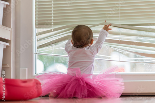 Cute little baby girl wearing a pink tutu photo