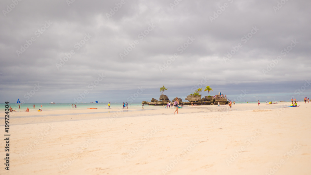 White beach Boracay with walking people. Philippines.