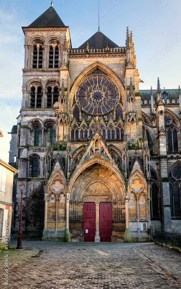 Lateral entrance with stained glass rose window of Chalons cathedral in France