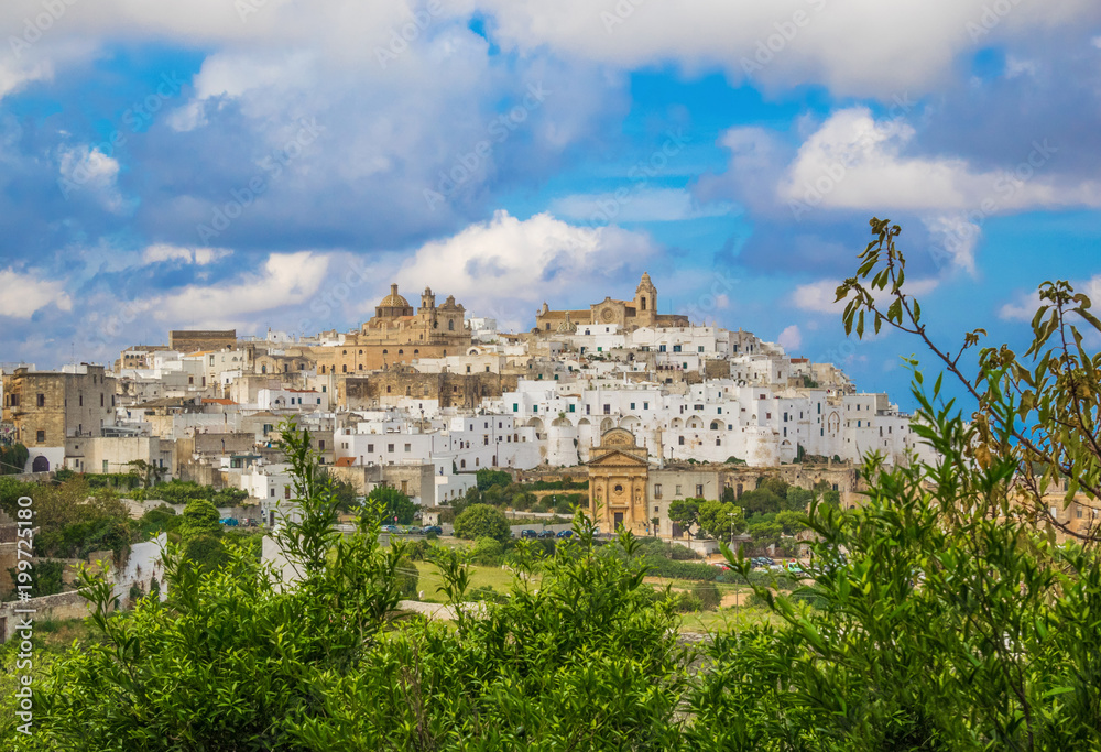 Fototapeta premium Ostuni (Puglia, Italy) - The gorgeous white city in province of Brindisi, Apulia region, Southern Italy, with the old historic center on the hill and beside the sea