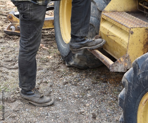 Stepping up on backhoe