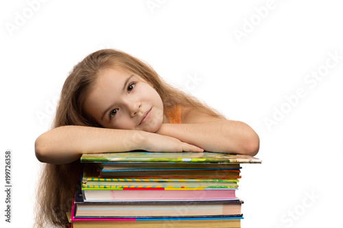 Cute caucasian little girl with books. School portrait. Isolated on white background