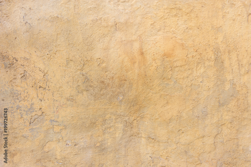 Weathered yellow painted wall background