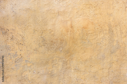 Weathered yellow painted wall background