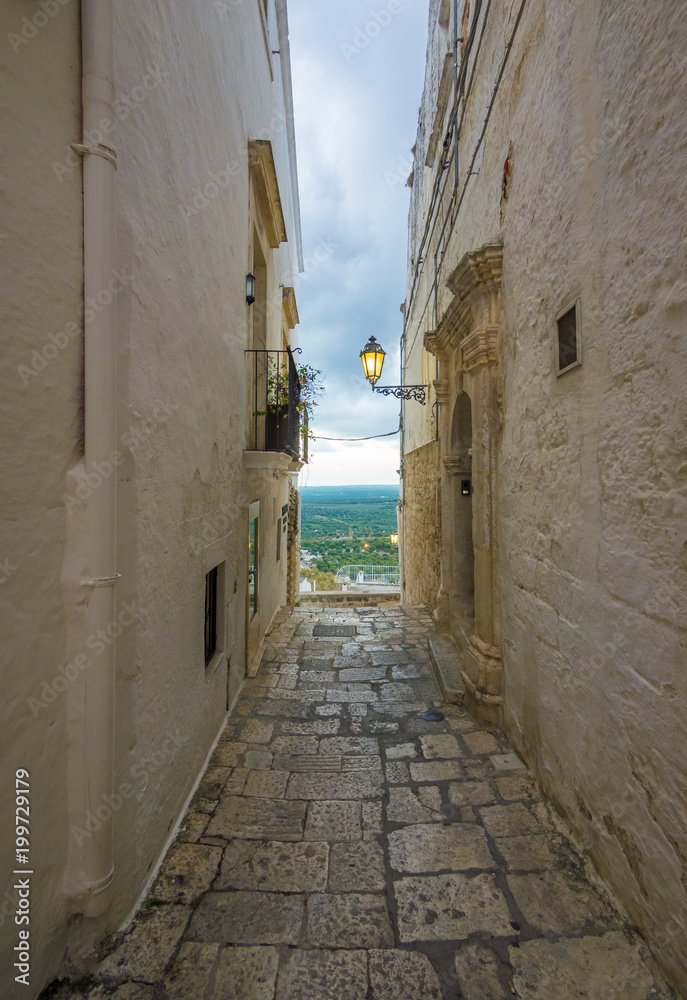 Obraz premium Ostuni (Puglia, Italy) - The gorgeous white city in province of Brindisi, Apulia region, Southern Italy, with the old historic center on the hill and beside the sea
