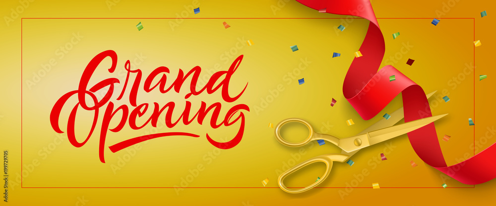 Grand opening banner with confetti and cutting rib