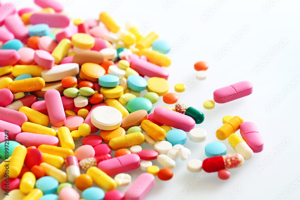 Colorful pills on a light background Colorful pills on a light background