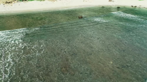 Tracking in aerial footage of Nampu beach, South Yogyakarta, Indonesia - March, 2018 photo